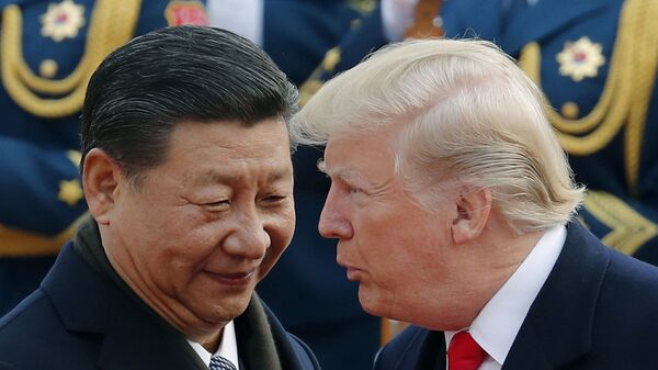 FILE - In this Nov. 9, 2017, file photo, U.S. President Donald Trump, right, chats with Chinese President Xi Jinping during a welcome ceremony at the Great Hall of the People in Beijing - Sputnik International