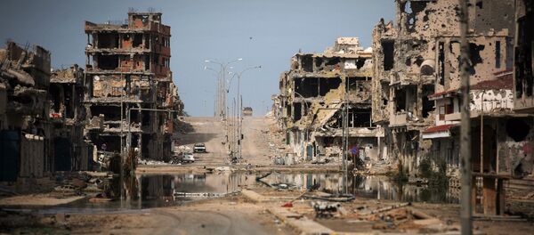 This Oct. 22, 2011 file photo, shows a general view of buildings ravaged by fighting in Sirte, Libya. - Sputnik International