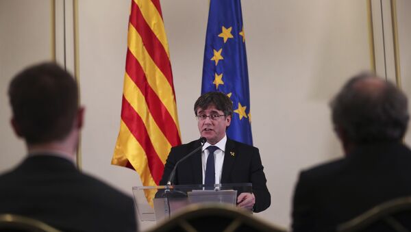 In this Feb. 18, 2019 file photo, Catalonia's former regional president. Carles Puigdemont, addresses a conference in Brussels. A political group that wants Catalonia to break away from Spain and become an independent country said on Sunday, March 10, 2019, that Puigdemont is running for a seat in the European Parliament even though the Spanish government considers him a fugitive. (AP Photo/Francisco Seco, File) - Sputnik International