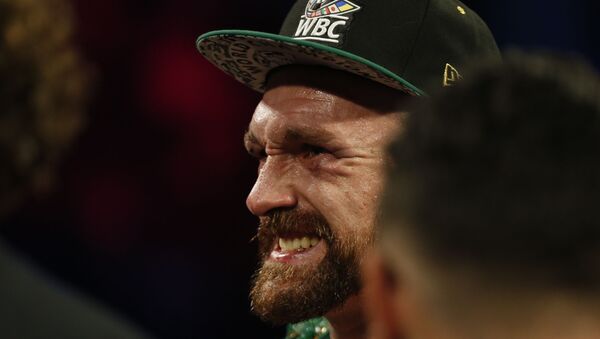 Boxing - Tyson Fury v Otto Wallin - T-Mobile Arena, Las Vegas, United States - September 14, 2019  Tyson Fury reacts as he stands in the ring after winning the fight by unanimous decision REUTERS/Steve Marcus - Sputnik International