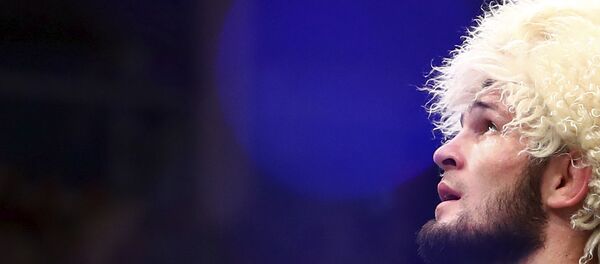 Russian UFC fighter Khabib Nurmagomedov speaks after wining against UFC fighter Dustin Poirier, of Lafayette, La., during Lightweight title mixed martial arts bout at UFC 242, in Yas Mall in Abu Dhabi, United Arab Emirates, early Sunday, Sept.8 2019. - Sputnik International