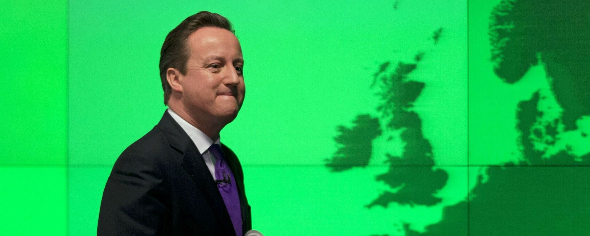 FILE - In this Wednesday, Jan. 23, 2013 file photo Britain's Prime Minister David Cameron walks past a map of Europe on a screen as he walks away after making a speech on holding a referendum on staying in the European Union in London. - Sputnik International, 1920, 25.02.2021