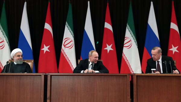 Iranian President Hassan Rouhani (L), Russian President Vladimir Putin (C) and Turkish President Recep Tayyip Erdogan (R) attending a press conference - Sputnik International