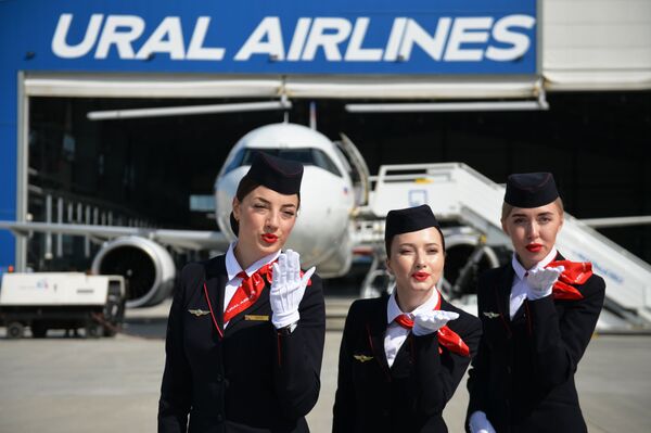 Flight attendants pose for photos at Koltsovo airport in Yekaterinburg during the presentation of a new Airbus A320neo plane purchased by Ural Airlines - Sputnik International