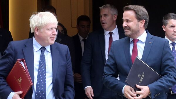 British Prime Minister Boris Johnson (L) and Luxembourg's Prime Minister Xavier Bettel (R) leave a meeting with EU Commission President and officials in Luxembourg on 16 September 2019.  - Sputnik International