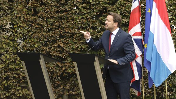 Luxembourg's Prime Minister Xavier Bettel, right, addresses a media conference next to an empty lectern intended for British Prime Minister Boris Johnson after a meeting at the prime ministers office in Luxembourg, Monday, Sept. 16, 2019.  - Sputnik International