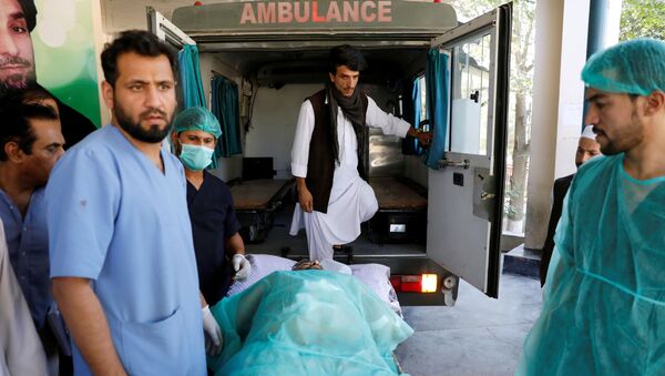 An injured man is transported to an ambulance at a hospital, after a blast in Kabul, Afghanistan September 17, 2019 - Sputnik International