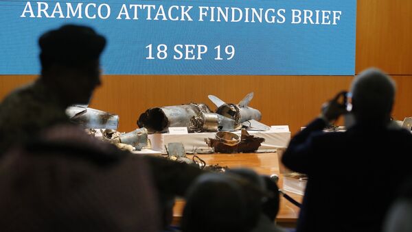 Journalists film what Saudi military spokesman Col. Turki al-Malki said was evidence of Iranian weaponry used in the attack targeted Saudi Aramco's facilities in Abqaiq and Khurais, during a press conference in Riyadh, Saudi Arabia, Wednesday, Sept. 18, 2019 - Sputnik International