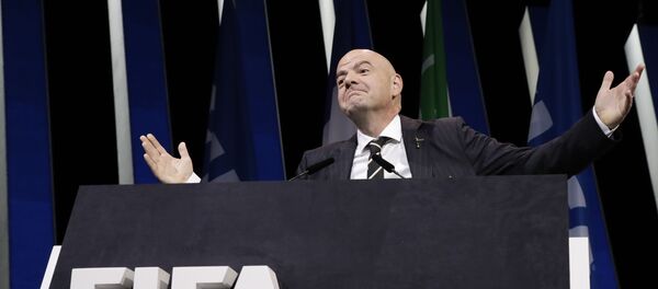 FIFA President Gianni Infantino gestures as he walks on the stage before the start of the 69th FIFA congress in Paris, Wednesday, June 5, 2019. FIFA President Gianni Infantino gestures as he walks on the stage before the start of the 69th FIFA congress in Paris, Wednesday, June 5, 2019. - Sputnik International