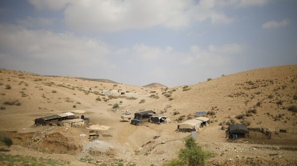 Palestinian Bedouin homes are seen in the Israeli-occupied West Bank, Wednesday, Sept. 11, 2019. Israeli Prime Minister Benjamin Netanyahu’s election eve vow to annex the Jordan Valley if he is re-elected has sparked an angry Arab rebuke and injected the Palestinians into a campaign that had almost entirely ignored them. (AP Photo/Ariel Schalit) - Sputnik International