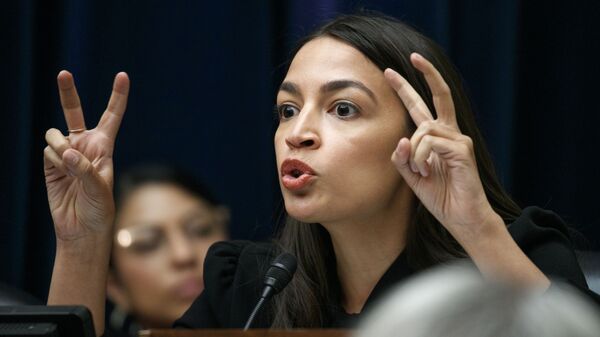 Rep. Alexandria Ocasio-Cortez, D-N.Y., asks a question during a House Oversight subcommittee hearing into the Trump administration's decision to stop considering requests from immigrants seeking to remain in the country for medical treatment and other hardships, Wednesday, Sept. 11, 2019, in Washington. - Sputnik International