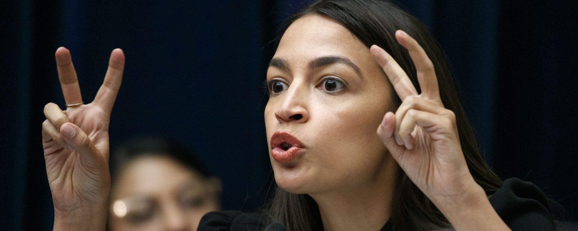 Rep. Alexandria Ocasio-Cortez, D-N.Y., asks a question during a House Oversight subcommittee hearing into the Trump administration's decision to stop considering requests from immigrants seeking to remain in the country for medical treatment and other hardships, Wednesday, Sept. 11, 2019, in Washington. - Sputnik International, 1920, 13.07.2020