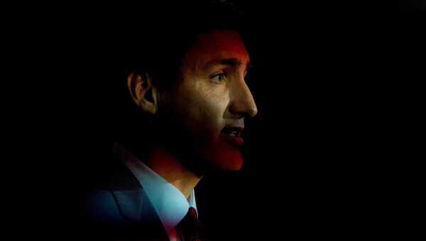Flickering lights shine as Canada's Prime Minister Justin Trudeau speaks during an election campaign stop in Toronto, Ontario, Canada September 20, 2019 - Sputnik International