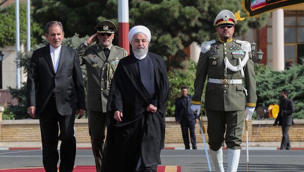 Iranian President Hassan Rouhani walks during a farewell ceremony before leaving for New York, in Tehran, Iran September 23, 2019. - Sputnik International