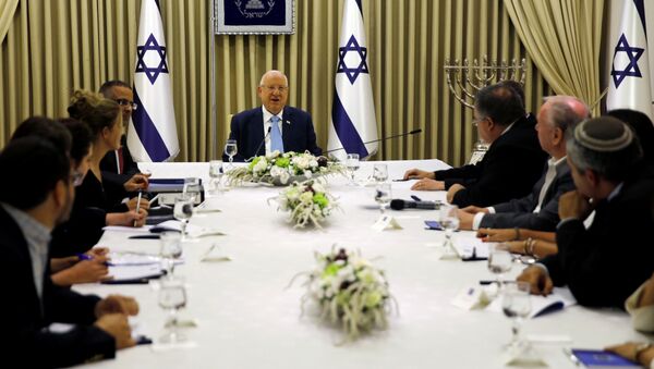 Memebers of the Likud party, sits next to Israeli President Reuven Rivlin as he began talks with political parties over who should form a new government, at his residence in Jerusalem September 22, 2019. - Sputnik International