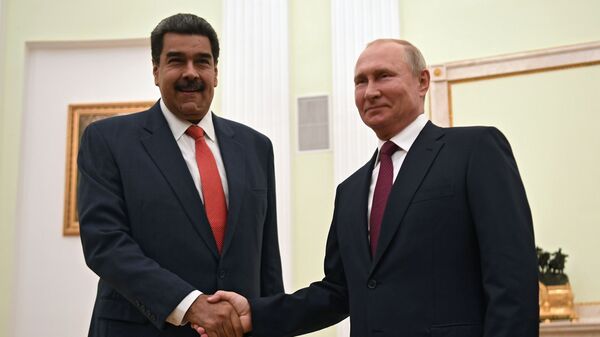 Russian President Vladimir Putin shakes hands with Venezuelan President Nicolas Maduro during a meeting at the Kremlin in Moscow, Russia September 25, 2019 - Sputnik International