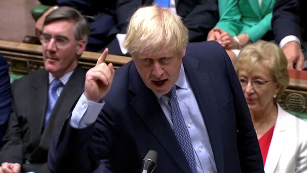 Britain's Prime Minister Boris Johnson gestures as he speaks at the parliament, which reconvenes after the UK Supreme Court ruled that his suspension of the parliament was unlawful, in London, Britain, September 25, 2019, in this screen grab taken from video - Sputnik International