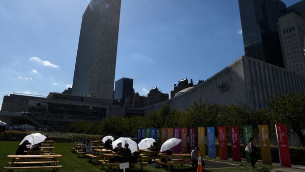 Attendees of the United Nations General Assembly use white umbrellas for shade at the United Nations in New York City, New York, U.S., September 25, 2019 - Sputnik International