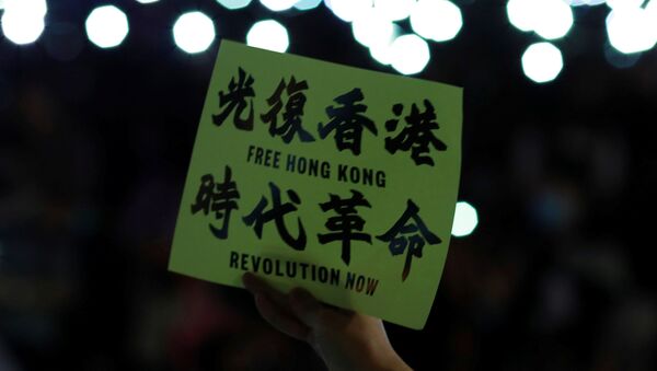An anti-government protester holds a placard during a rally at Edinburgh Place to show solidarity for arrested political activists being held at San Uk Ling detention centre in Hong Kong, China 27 September 2019.  - Sputnik International