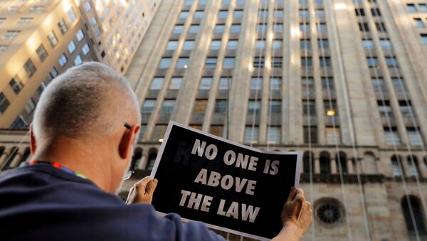 Demonstrators hold protest signs as part of a demonstration in support of impeachment hearings in New York, U.S., September 26, 2019.  - Sputnik International