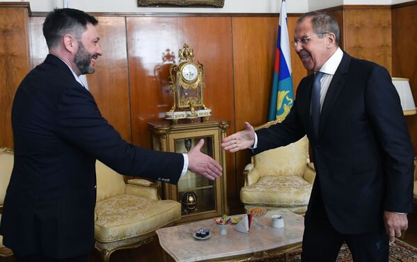 RIA Novosti Ukraine editor-in-chief Kirill Vyshinsky and Russia's Foreign Minister Sergei Lavrov during a meeting in Moscow.  - Sputnik International