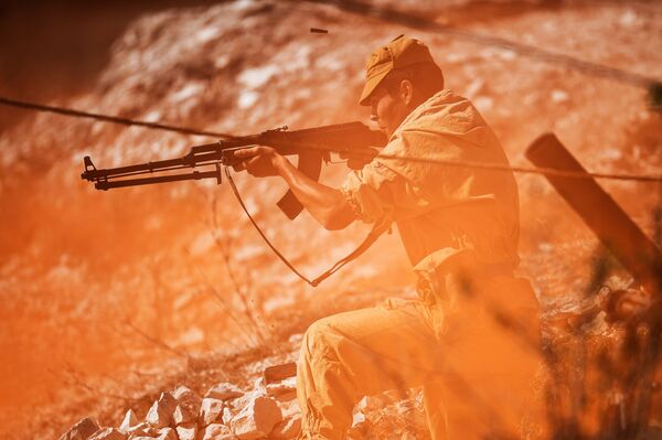 A person takes part in the re-enactment of an episode from the 1979-1989 Afghan war during the 6th Military and History Festival in Crimea. - Sputnik International