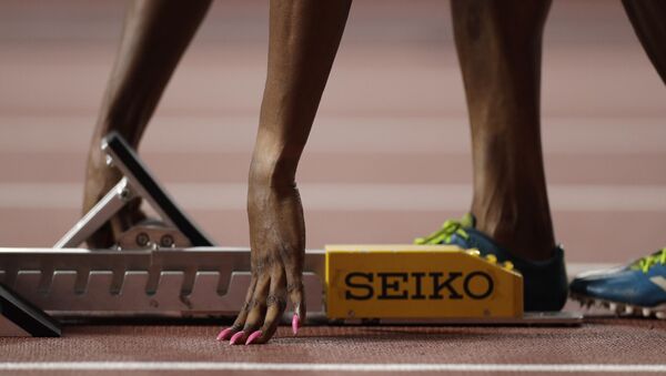 Patience Okon George, of Nigeria adjusts her starting blocks before a women's 400 meter heat at the World Athletics Championships in Doha, Qatar, Monday, Sept. 30, 2019. - Sputnik International