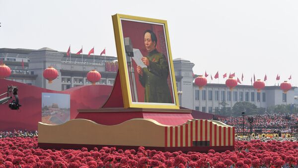 A giant portrait of former Chinese Communist Party leader Mao Zedong passes by Tiananmen Square during the National Day parade in Beijing on October 1, 2019, to mark the 70th anniversary of the founding of the People's Republic of China. - Sputnik International