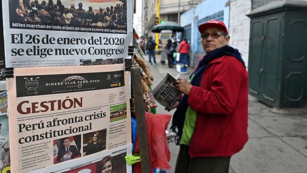 A man stands at a kiosk displaying front pages of newspapers in Lima on October 1, 2019, a day after Presiden Martin Vizcarra dissolved the unicameral Congress. - Sputnik International