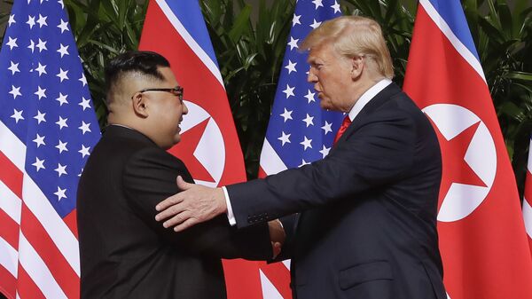 n this June 12, 2018 file photo, U.S. President Donald Trump, right, shakes hands with North Korea leader Kim Jong Un at the Capella resort on Sentosa Island in Singapore. Kim’s fifth meeting with Chinese President Xi Jinping continues his ambitious diplomatic outreach that has included summits with the leaders of the United States, South Korea and Russia in the past year and a half. Experts say Kim is attempting to form a united front with North Korea’s main ally China to strengthen his leverage in the stalled nuclear negotiations with the United States.  - Sputnik International