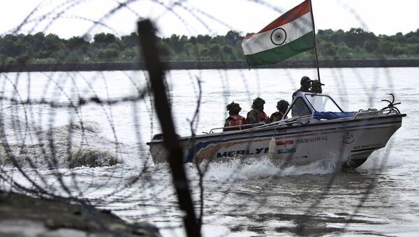 In this Tuesday, Aug. 13, 2019 file photo, Indian Border Security Force (BSF) soldiers patrol on a boat in river Chenab at Pargwal area along the India-Pakistan border in Akhnoor, about 55 kilometers (34 miles) west of Jammu, India - Sputnik International