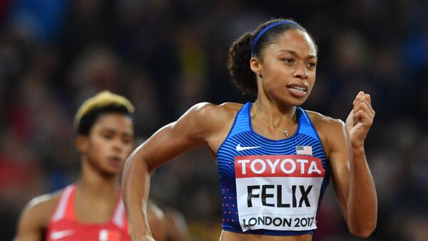In this file photo taken on August 9, 2017 US athlete Allyson Felix competes in the final of the women's 400m athletics event at the 2017 IAAF World Championships at the London Stadium in London. - Sputnik International