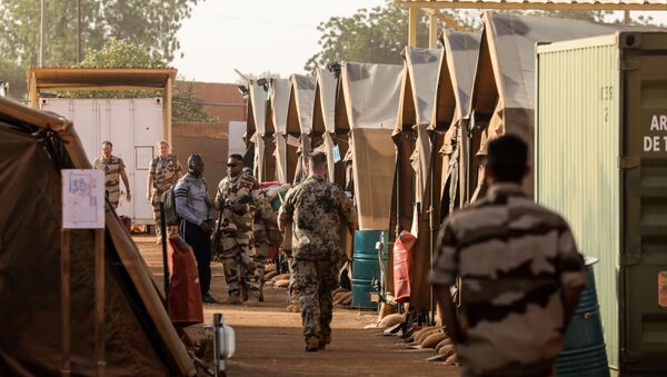 Soldiers of France's Barkhane mission walk in the military camp set up in a part of the airport base on December 22, 2017, in Niamey - Sputnik International