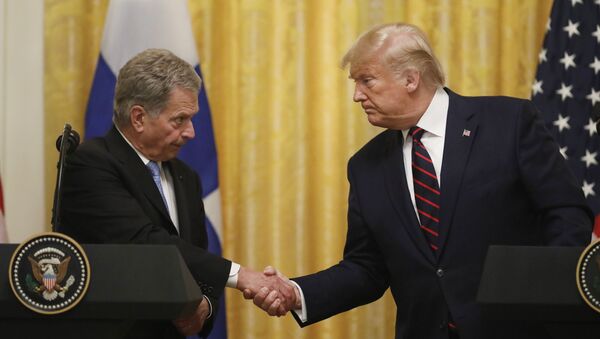 President Donald Trump shakes hands with Finnish President Sauli Niinisto, as they participate in a news conference at the White House in Washington, Wednesday, Oct. 2, 2019 - Sputnik International