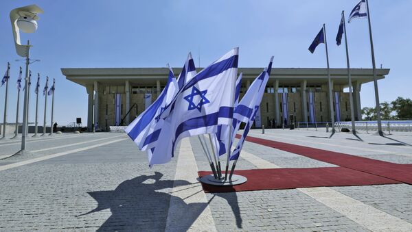 This picture taken on October 3, 2019 shows Israeli flags flying outside the Knesset (Israeli parliament) headquarters in Jerusalem - Sputnik International