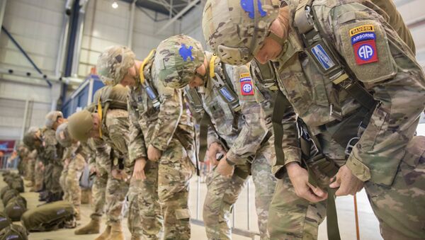 A group of U.S. Army and International Paratroopers rig into their parachutes and prepare to jump into Groesbeck Drop Zone during the 75th Anniversary of Market Garden on Einhoven Air Field, Einhoven, Netherlands., September 19, 2019 - Sputnik International