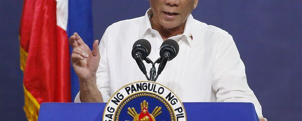 FILE - In this Aug. 27, 2019, file photo, Philippine President Rodrigo Duterte gestures as he addresses the topic of land reform in Manila, Philippines FILE - In this Aug. 27, 2019, file photo, Philippine President Rodrigo Duterte gestures as he addresses the topic of land reform in Manila, Philippines - Sputnik International