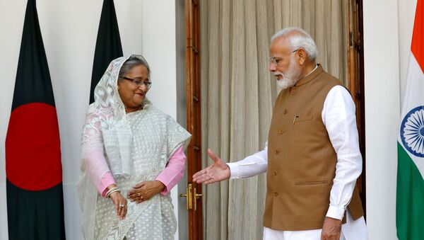 India's Prime Minister Narendra Modi shakes hands with his Bangladeshi counterpart Sheikh Hasina before their meeting at Hyderabad House in New Delhi, India, October 5, 2019.  - Sputnik International
