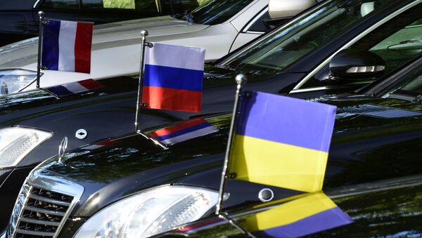 Flags mounted on the official cars are seen in Berlin on June 11, 2018, during a Normandy Format meeting of foreign ministers from France, Germany, Ukraine and Russia on the conflict in Ukraine. - Sputnik International