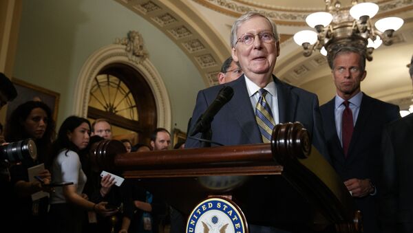 Republican Senate Majority Leader Mitch McConnell of Kentucky smiles as he speaks to members of the media, next to South Dakota Republican Senator John Thune, right, on 24 September 2019 after a GOP policy luncheon on Capitol Hill in Washington. - Sputnik International
