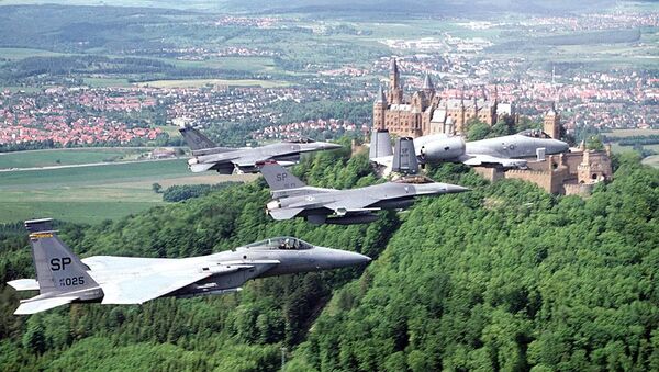 US fighter jets , an F-15 (L) two F-16 (C) and an A-10, assigned to Spangdahlem Air Base (Germany), fly a training past a German castle 10 March 1999.  - Sputnik International