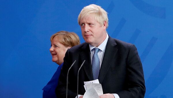 Britain's Prime Minister Boris Johnson holds his notes as he attends a news conference with German Chancellor Angela Merkel at the Chancellery in Berlin, Germany August 21, 2019.  - Sputnik International
