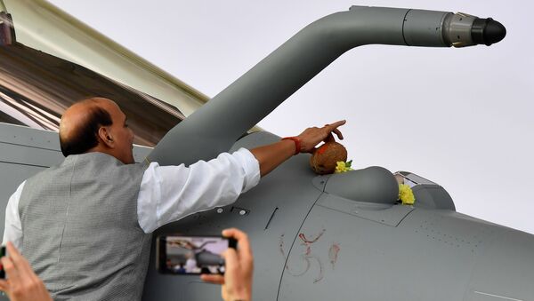 Indian Defence minister Rajnath Singh inaugurates the first of 36 Rafale fighter jets destined for India during the delivery ceremony, on October 8, 2019 at Dassault Aviation plant in Merignac.  - Sputnik International