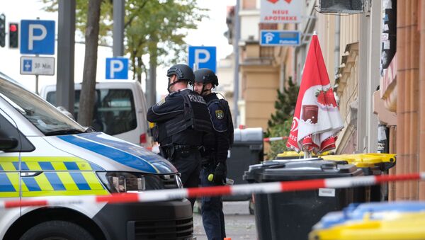 Policemen secure the area around the site of a shooting in Halle an der Saale, eastern Germany, on October 9, 2019. - Sputnik International