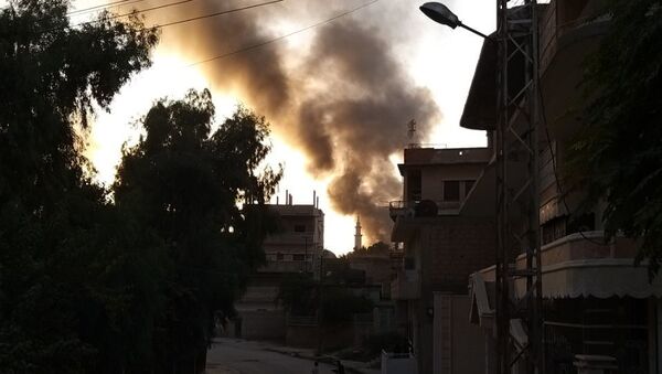 Smoke is seen billowing in Ras al-Ain - Sputnik International