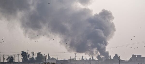 Smoke rises from the Syrian town of Tal Abyad after Turkish bombings, in a picture taken from the Turkish side of the border near Akcakale in the Sanliurfa province on October 9, 2019. - Sputnik International