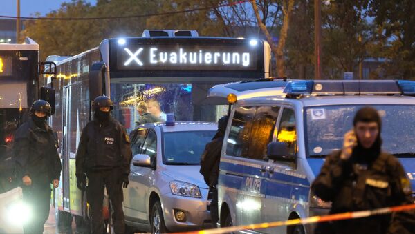 A bus reading evacuation is escorted by the police past the site of a shooting in Halle an der Saale, eastern Germany, on October 9, 2019. - Sputnik International