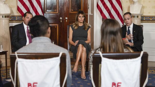 US First Lady Melania Trump (C), Health and Human Services Secretary Alex Azar (L) and Eric Asche, chief marketing officer of the Truth Initiative, attend a listening session with teenagers about vaping in the Blue Room at the White House in Washington, DC, on October 9, 2019 - Sputnik International