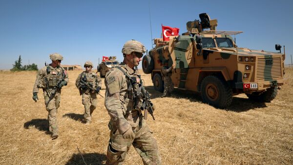 American soldiers walk together during a joint U.S.-Turkey patrol, near Tel Abyad, Syria September 8, 2019 - Sputnik International