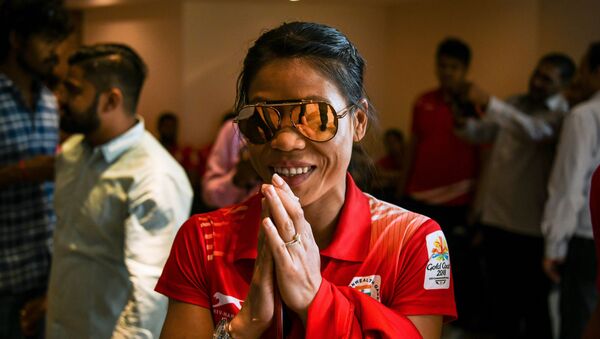 Indian boxer Mary Kom gestures as she arrives at a ceremony for the victorious Indian boxing contingent at the 2018 Commonwealth Games, in New Delhi on April 17, 2018 - Sputnik International